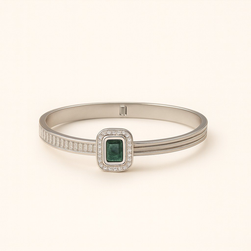 Women's Silver Plated Bangle with a central emerald-cut green CZ stone and side baguette CZ accents.