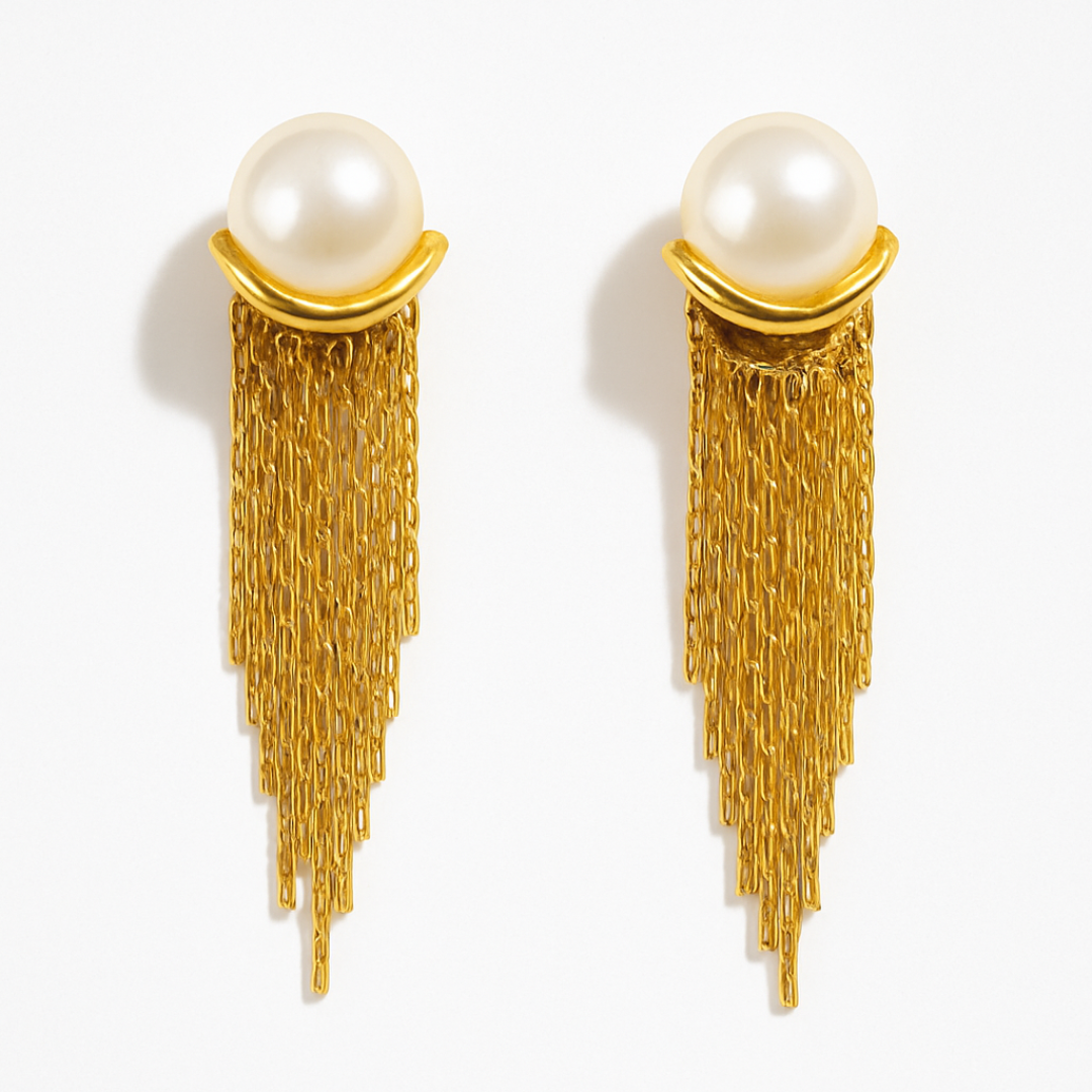 Gold Toned Drop Earrings with a large white imitation pearl and a long, tapering cascade of fine gold chains forming a fringe tassel.