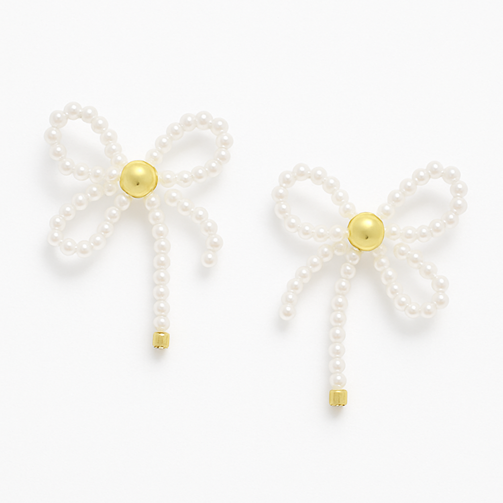 Gold and Pearl Beaded Bow Stud Earrings with tails, made from small imitation pearls and centered with a polished gold-toned bead.