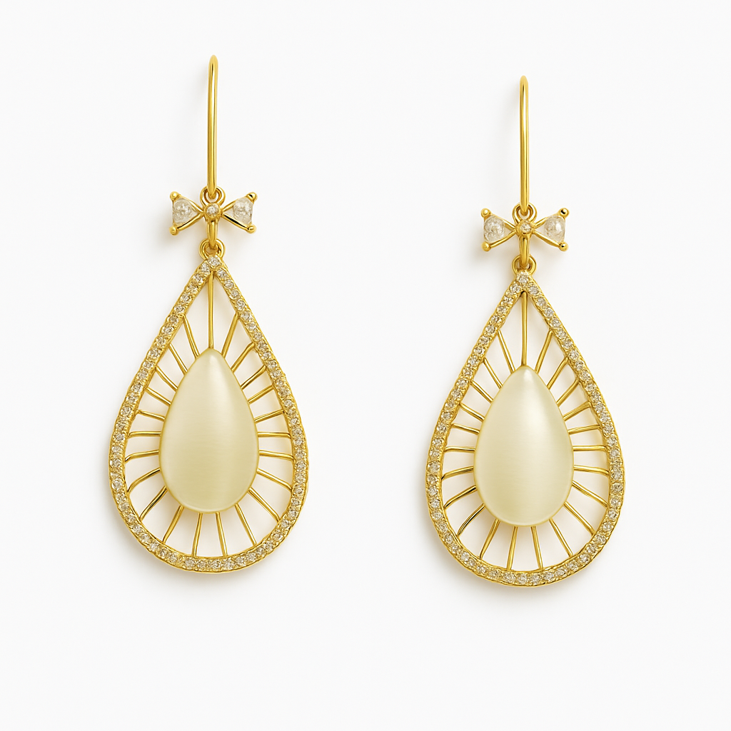 Gold Plated Teardrop Dangle Earrings with an intricate filigree frame, large opalescent stone, and a CZ bow detail at the ear wire.