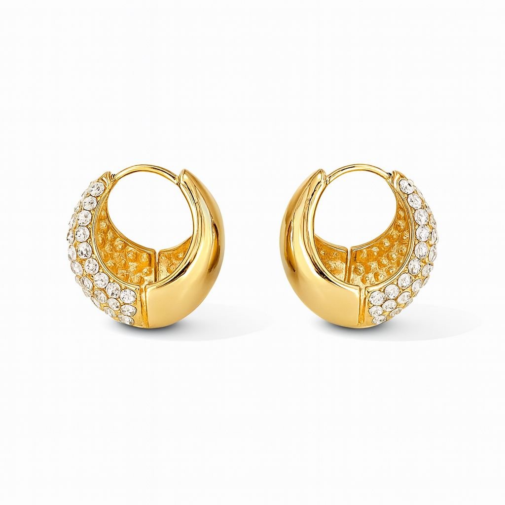 Gold Toned Chunky Huggie Hoop Earrings with one half covered in clear pave CZ stones and the other half highly polished metal.