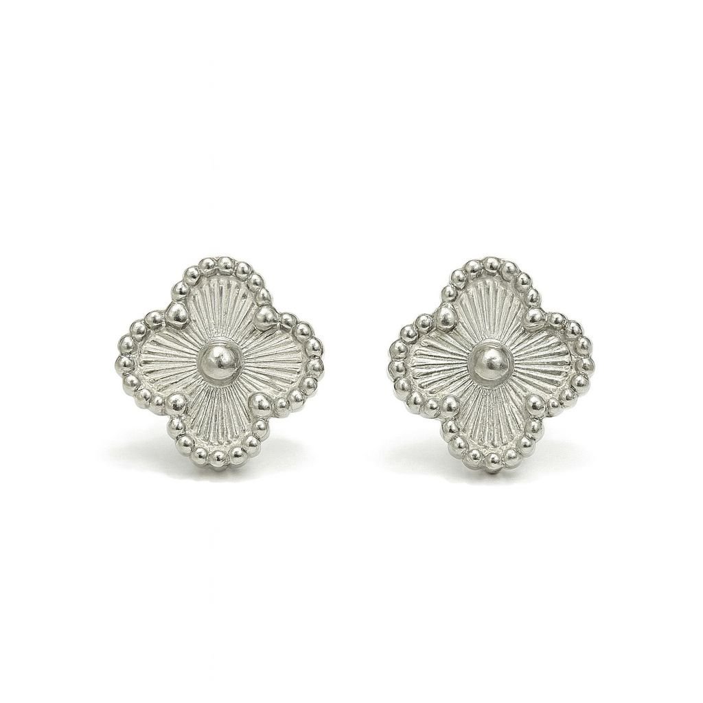 Silver Toned Clover Stud Earrings with a beaded edge and a sunburst or ray pattern radiating from the center.