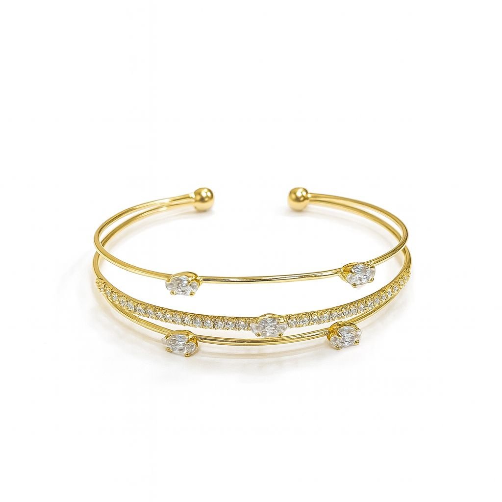 Women's Gold Plated Bangle with a triple-band cuff design featuring pave and solitaire CZ stones.