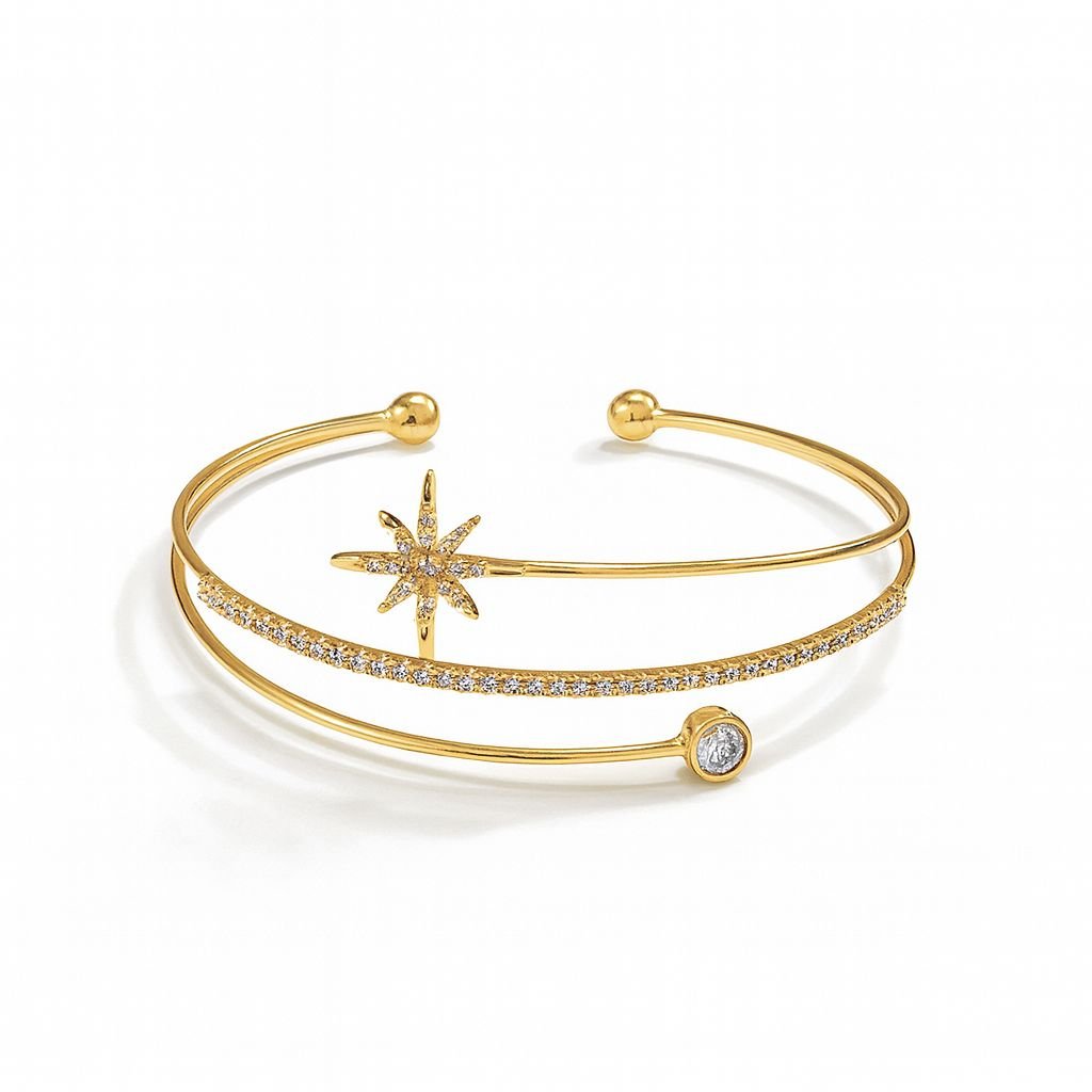 Women's Gold Plated Bangle with a CZ starburst motif and solitaire stone on a double-band cuff.