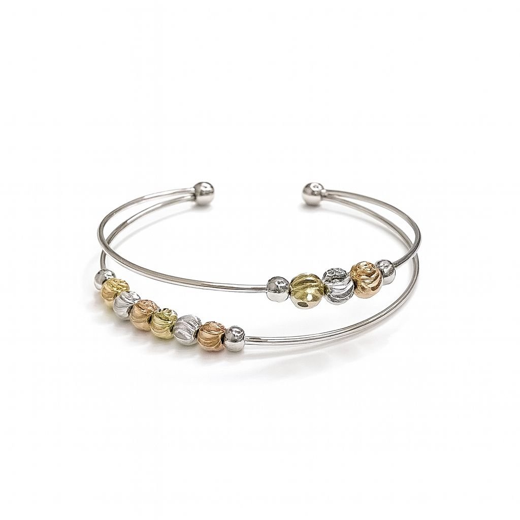 Women's Beaded Cuff Bangle with gold, silver, and rose-toned metal beads on a double-band cuff.